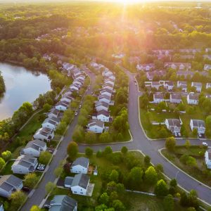Aerial view of modern roofs of houses of residential area summer houses early sunrise